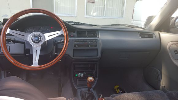Installed my full nrg qr setup along with mu full nardi woodgrain setup steering wheel and shift knob and ebrake handle and cd player and usdm console u got recently after selling my other consols
