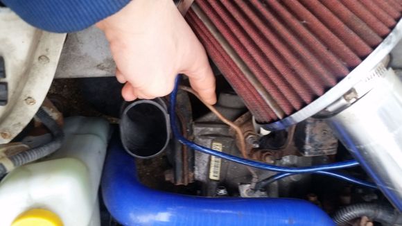 This wire is located on the passenger side, connecting between the transmission and side of the passenger wheel well. It's quite easy to reach and is visible without moving anything as you can see here.