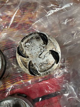 Valve drop on piston. I’m sure she t can be buffed out.