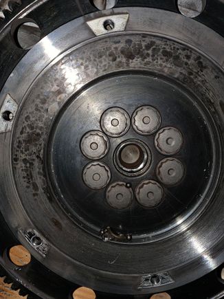 From this picture, I’m going to summarize a series of failures. 
1. Broke pass. Side axle but didn’t realize, 
2. dropped and opened trans to find nothing wrong,
3. Friend was guiding me/could not get trans cases to click together tapped on input shaft to see if that would help. 
4. Slightly mushroomed input shaft tip/got case together lol
5. Input shaft pressed on pilot bearing instead of seating inside. Replace axle. 
6. I ran it because of hardship, needed car to drive. 