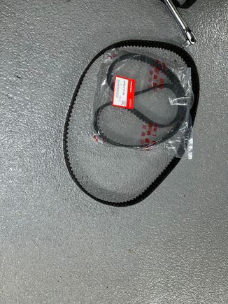 Old timing belt and new OEM timing belt still in the package