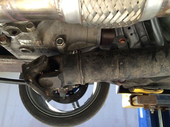 About 6". It measures just under 38" from center bearing mount to flange.