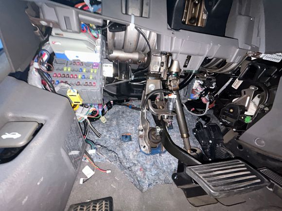 You can see next to the kick panel there are random wires laying disconnected, some with labels too. Wondering if that might be part of an aftermarket kit?
