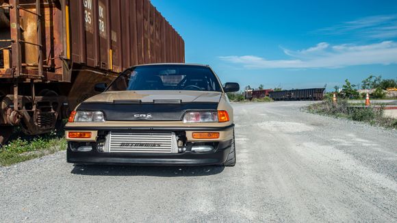 the far right top and far left top opening. a front splitter rod going up through that area may make it grow on me more.