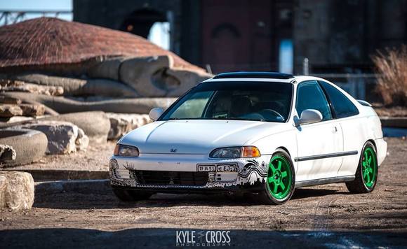 5 years later and back on the streets. Junk yard bumper living a second life as a rolling piece of art!
