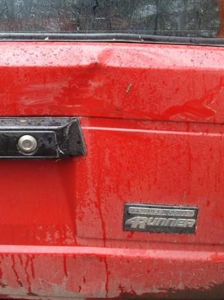 My B/F backed into a tree when we were out muddin'.  It's the first and only dent.