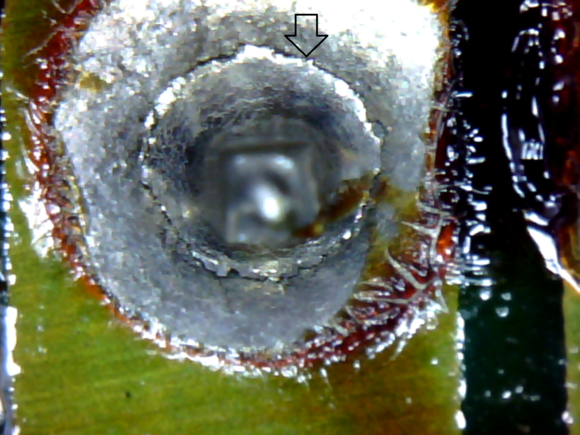 Arrow points to fracture ring where the solder joint has fractured.  This is the worst joint on the circuit board and as far as I can determine is the point of failure.