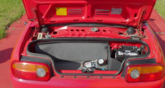 Loads of trunk space.  But it's clean trunk space.  Probably big enough for all the Nitrous you can ever dream to rice it out with.