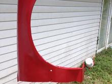 Painted the fenders and trim red cause all I had was red semi-gloss left to at least seal the replacement fender on the passenger side from rust.
