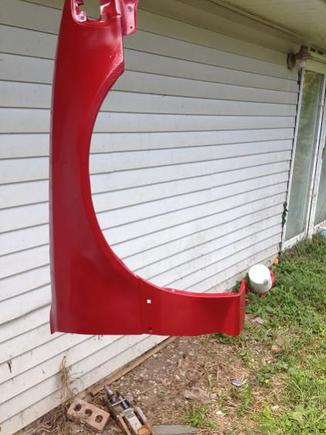 Painted the fenders and trim red cause all I had was red semi-gloss left to at least seal the replacement fender on the passenger side from rust.
