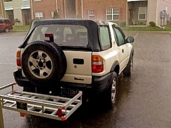 My wimpy Harbor Freight cargo carrier that got destroyed when I got rear-ended.....thank God. Gonna' weld-up my own cargo carrier.