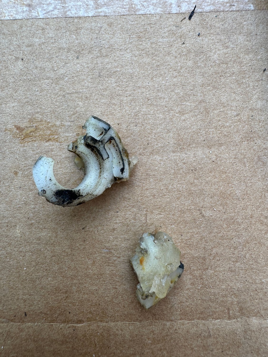 Broken window rollers from dealer repair over 10 years ago in bottom of door