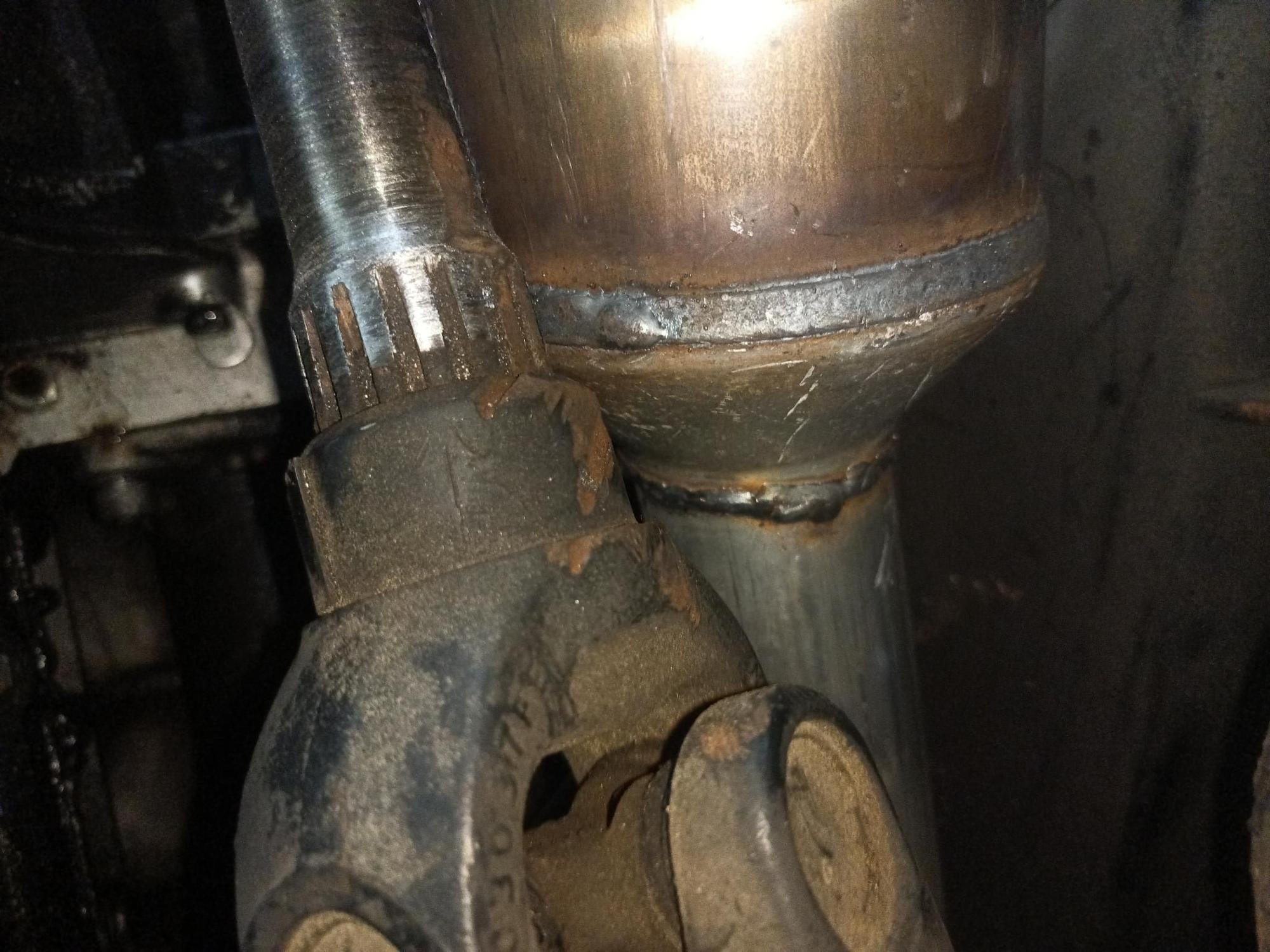 Picture of cat pushing hard into front drive shaft.