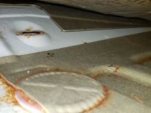 hole for worn out grommet is in upper left.