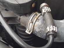 Radiator with broken nipple and a half ass fix resulting in a coolant leak