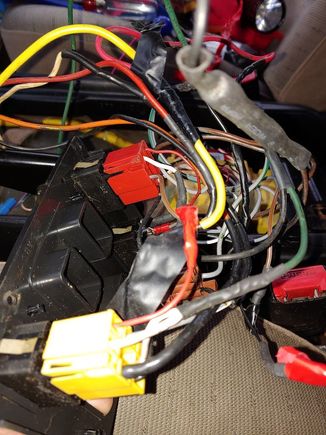 More creative wiring, orange and black big wires are what they used to join the footwell window wiring together, and large yellow taps into the ignition power with a 10amp fuse holder inline.