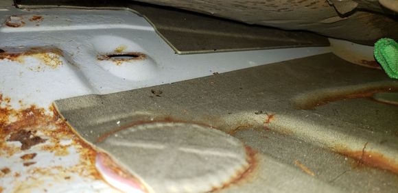 hole for worn out grommet is in upper left.