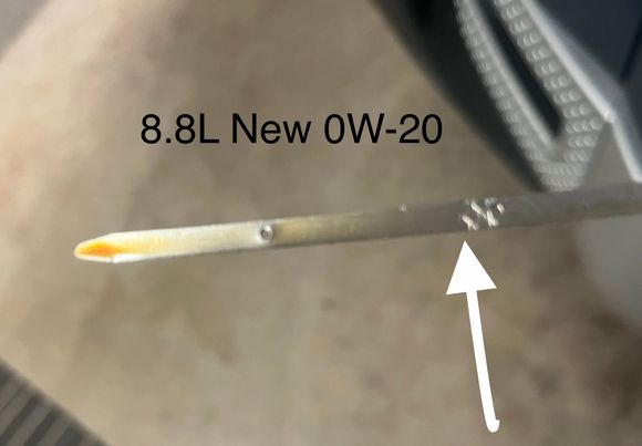 This is right after a fill with 8.8 L of new oil. 

A very light straw color and a correct fill volume. 