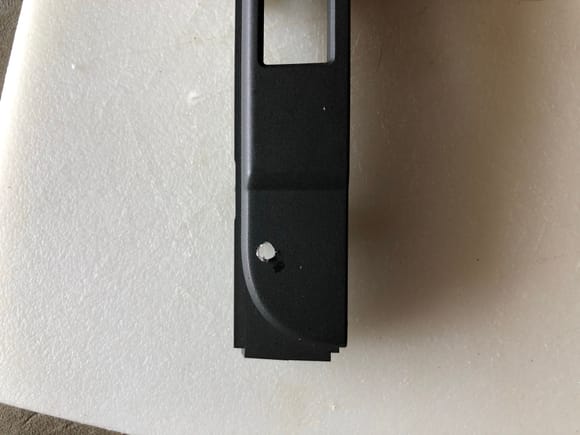Hole drilled in trim plate for phone mount