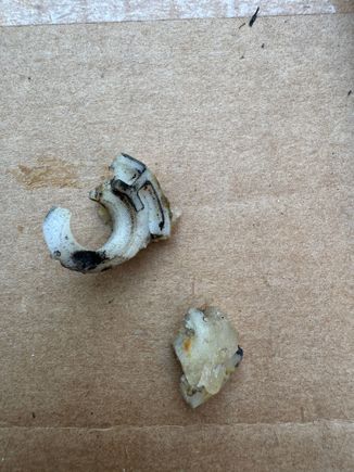 Broken window rollers from dealer repair over 10 years ago in bottom of door