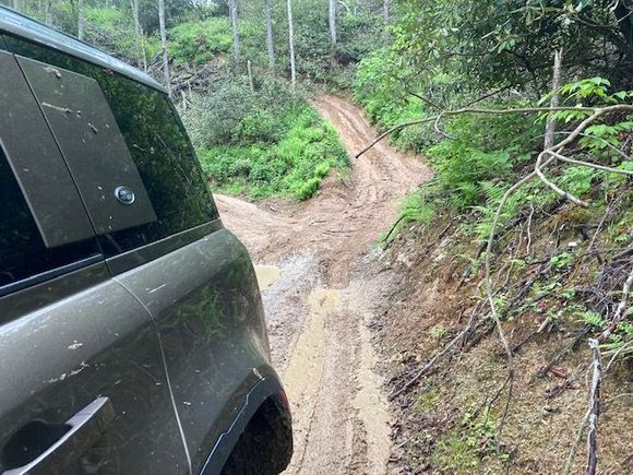 The vehicle's next need is a guard for the rear differential -- and some better tires (of course).

On one deeply rutted section the rear diff. shaved an inch of mud off the top of the center of the track --- I avoided rocks all day for this reason. 