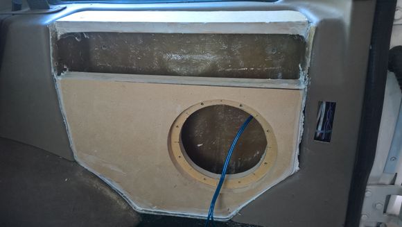 Doubled 1/2" MDF for a rigid surface for the subwoofer and to allow the subwoofer to be recessed for a flush look.