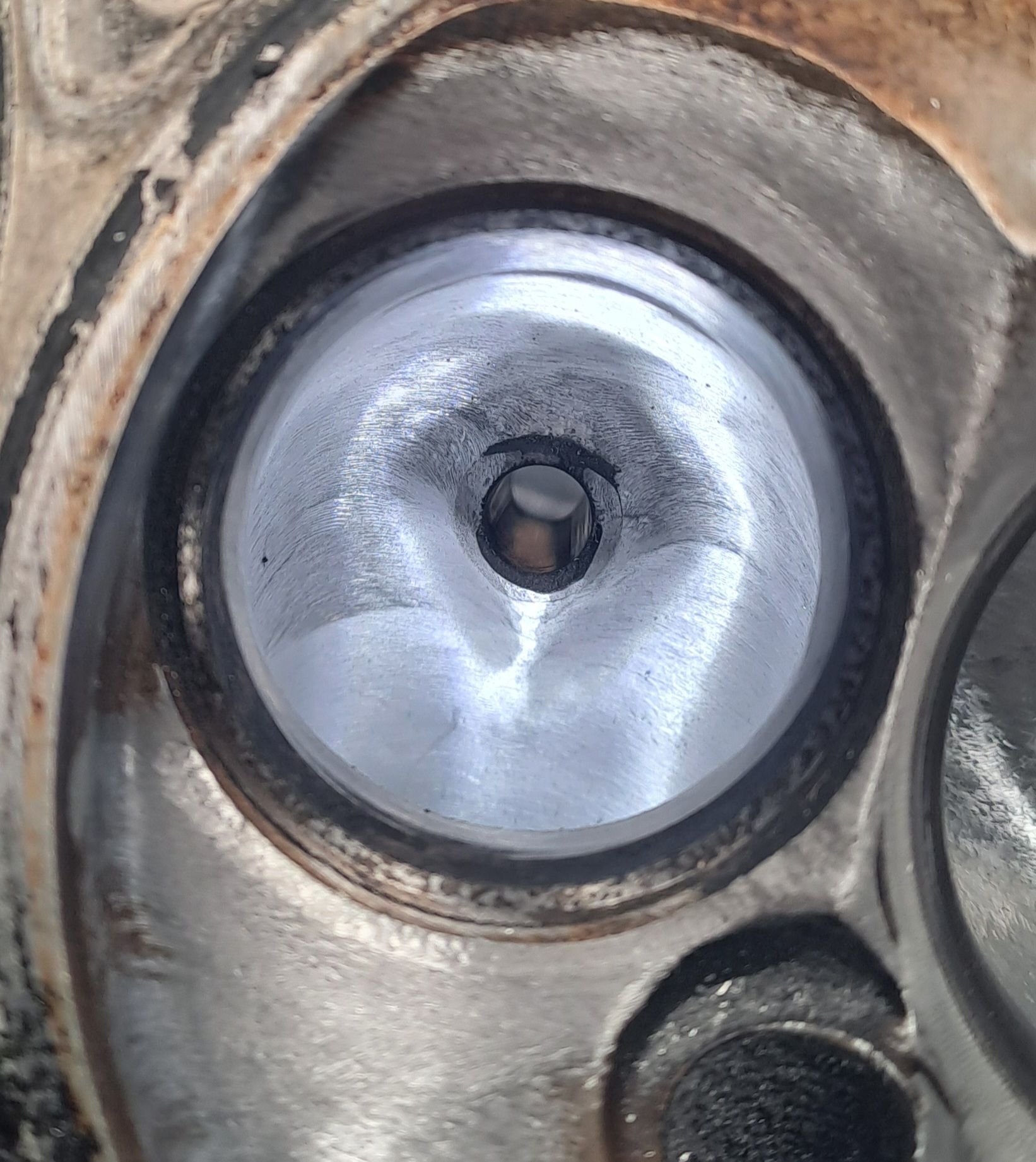 Exhaust port throat bowl and valve guide.