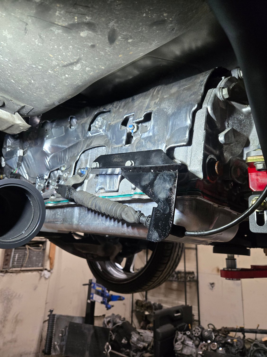 Made shift cable bracket to keep factory shift on 10 speed