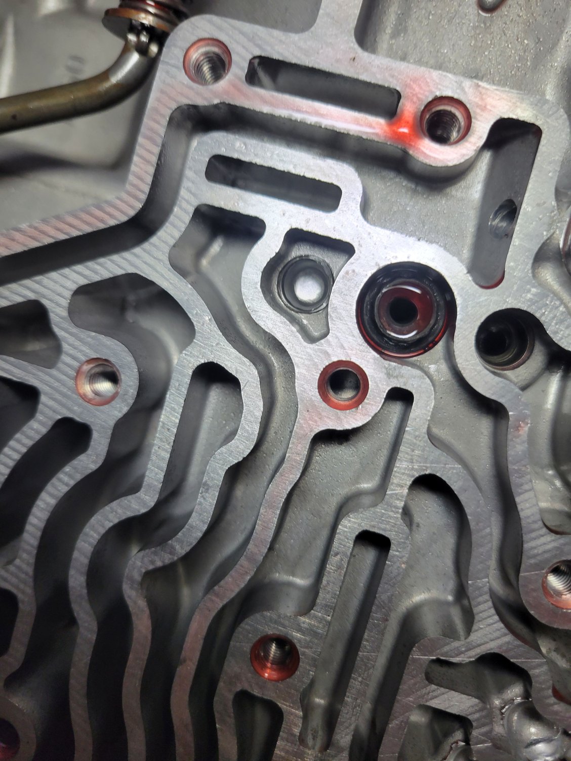 Dual feed id say.   I pressured everything i could except a couple places along the front edge that i couldn't get to when i had the valve body off.  Everything made a thud sound and i never heard air pouring out anywhere. 