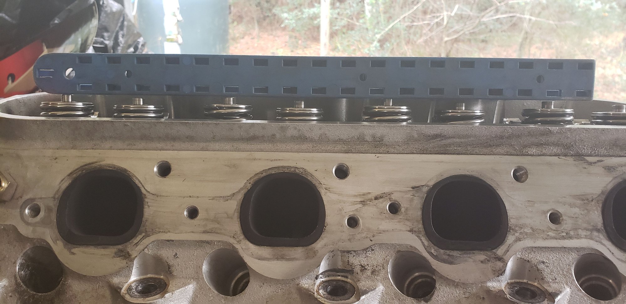 My intake valves sat higher than the exhaust valves in my case.