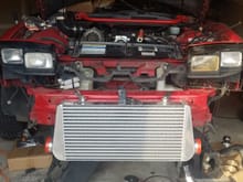 new intercooler mounted into place. much more intercooler inplace. not sure if i will trim it or leave it as is. still have to see hiw it fits with the nose back on.