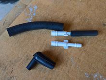 I replaced it with an adapter fitting and some proper automotive hoses which should withstand plenty of abuse.