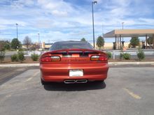 added black "Camaro" lettering inserts, Stock SLP center-mount exhaust.