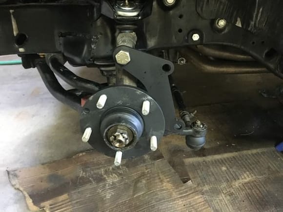 OEM drum brake hub turned to 5.80", with a bracket I designed and had jetted from 3/8" steel.