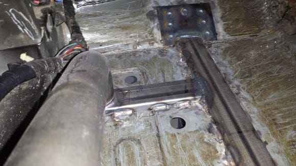 Through floor subframe connectors welded in. Outriggers will be used to set roll cage down onto.