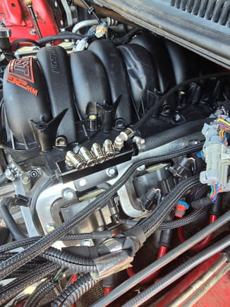 Using the coil bracket bolt to hold down the vacuum manifold. Started to plumb the referernce lines. 