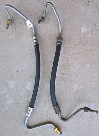 Fixed the oil leak by installing an all new engine, so the rear axle leaked. I fixed that, so of course the power steering had to spring a leak the next day. New OEM high pressure line on left, leaking one on right.