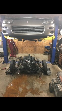 So the new owner of Lil’ Brownie sent me this from the weekend. The removal of the perfectly good LS1 aluminum engine for parts to facilitate the other 853 headed LS1/LT conversion in his white thirtieth. He chuckled at the thought of replacing it with a tiny iron block truck engine.