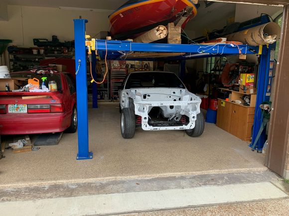 I had been working on the construction of that paint booth for so long that I was ready to have my garage back.  The booth came down almost immediately.  That's a Whip Industries, 4-post lift that's made up in DFW.  I ordered it online about 4 years ago then drove up there and picked it up.  On top of the lift is my 1973 Sanger runnerbottom V-drive drag boat.  Big block Chevy powered.  I've owned it since 1986.  I'm embarrassed to tell people that last time it was in the water.