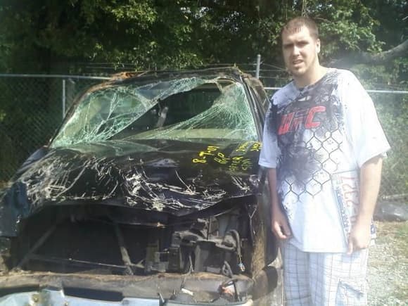 me and my wrecked avalanche.....had to get a sports car and keep it chevy!!!!