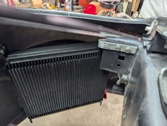 I also made new mounts for a larger oil cooler to fit inside the front bumper, and fed by the brake duct opening.
