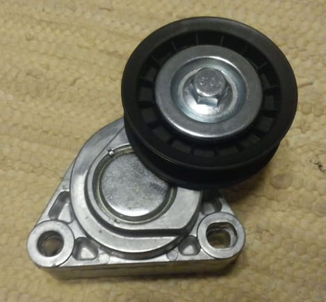 Tensioner, measures 3.25" from outer edge of pulley to rear of mount.