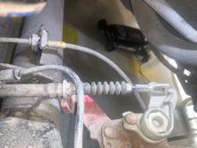 Driver's side unhooked from caliper lever and housing un-clipped from caliper 