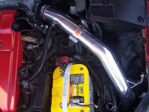 Closer view of intake, filter drops down in front of the driver's tire behind the bumper