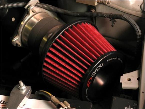 Although the Apexi Pop-Charger is very expensive, it has a built-in Velocity Stack design on the collar, and a reverse cone design at the cap, for optimum air flow. Just about the most efficient pop-charger made. Damn attractive, too.