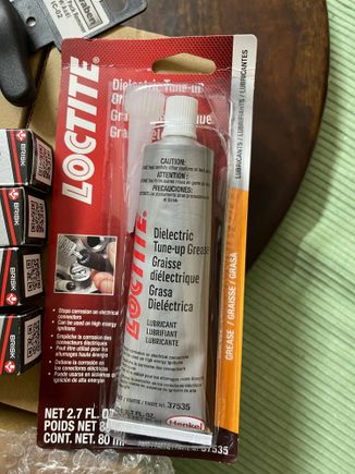Loctite Dielectric grease from ECS Tuning.