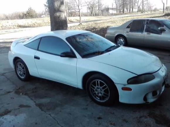 Cracked front bumper and bent hood