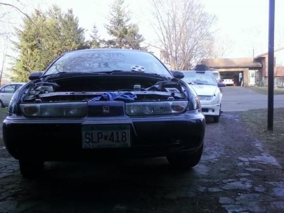 the day i put the motor back in .. donor car in the backround