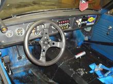 inside of the shops datsun 3/4 chassie full set of autometer gaugse microtek stand alone