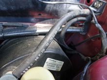 Heres the location its on the right side of the pic. The hose leads to the interior.